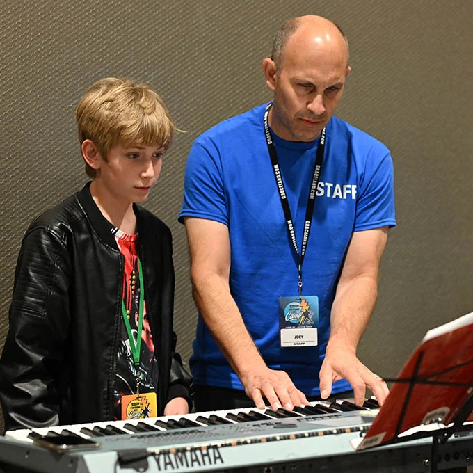 Graceland Performing Arts Camp Boy and Teacher with Piano | The Guest House at Graceland Graceland Performing Arts Camp Boy and Teacher with Piano